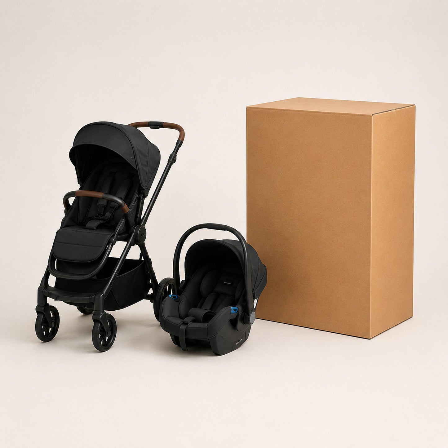 Travel system with pushchair and car seat shown beside an extra large cardboard shipping box